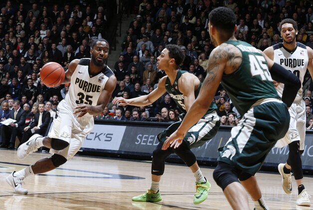 Feb 9, 2016; West Lafayette, IN, USA; Purdue Boilermakers guard Rapheal Davis (35) drives to the basket against Michigan State Spartans guard Bryn Forbes (5) at Mackey Arena. Mandatory Credit: Brian Spurlock-USA TODAY Sports