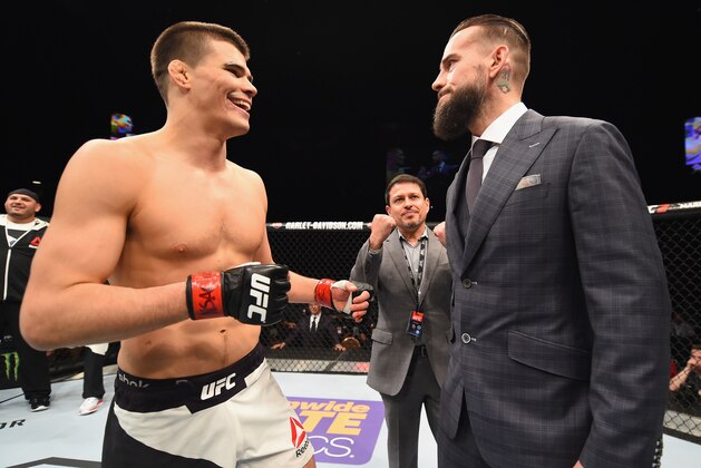 LAS VEGAS, NV - FEBRUARY 06:  (R-L) Phil 'CM Punk' Brooks faces off with Mickey Gall after Gall's victory over Mike Jackson during the UFC Fight Night event at MGM Grand Garden Arena on February 6, 2016 in Las Vegas, Nevada.  (Photo by Jeff Bottari/Zuffa LLC/Zuffa LLC via Getty Images)