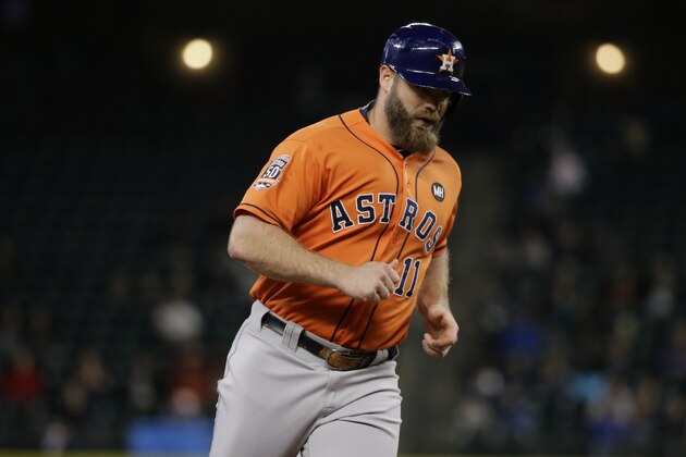 Houston Astros' Evan Gattis rounds the bases after hitting a home run during a baseball game against the Seattle Mariners, Monday, Sept. 28, 2015, in Seattle. (AP Photo/Ted S. Warren)