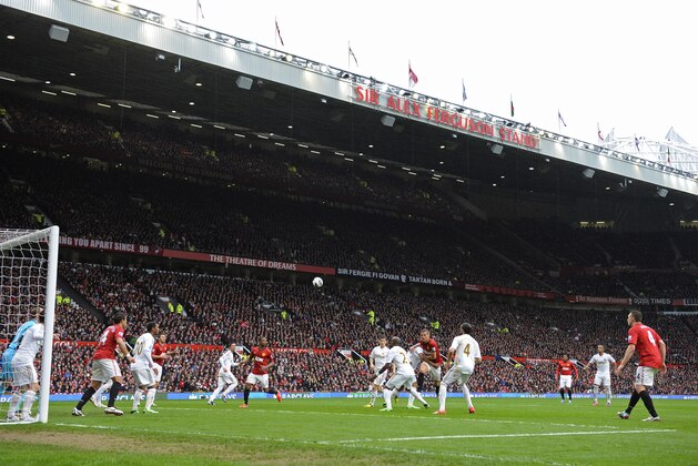 MANCHESTER, UNITED KINGDOM - MAY 12:  Play in the 2nd half goes on in front of the massive Sir Alex Ferguson stand during Manchester United versus Swansea City FA Premier League match, the final home game for Sir Alex Ferguson as United manager, at Old Trafford on May 12th 2013 in Manchester (Photo by Tom Jenkins/Getty Images)