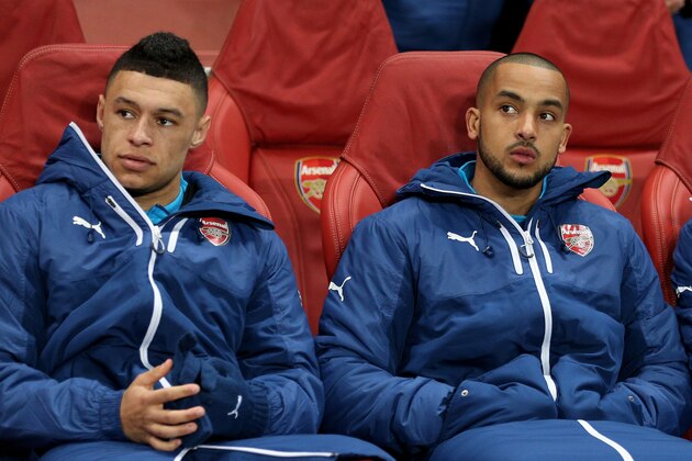LONDON, ENGLAND - FEBRUARY 25:  (L-R) Alex Oxlade-Chamberlain, Theo Walcott and Wojciech Szczesny of Arsenal look on from the substitutes bench  during the UEFA Champions League round of 16, first leg match between Arsenal and Monaco at The Emirates Stadium on February 25, 2015 in London, United Kingdom.  (Photo by Clive Mason/Getty Images)