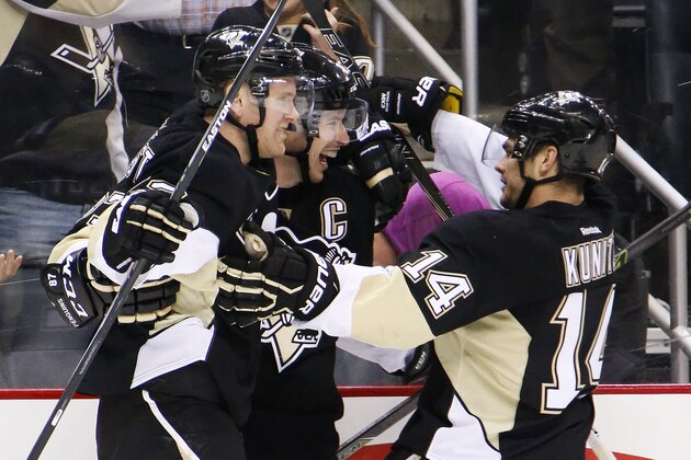 Pittsburgh Penguins' Sidney Crosby, center, celebrates his goal with teammates Patric Hornqvist, left, and Chris Kunitz (14) during the second period of an NHL hockey game against the Anaheim Ducks in Pittsburgh, Monday, Feb. 8, 2016. (AP Photo/Gene J. Puskar)