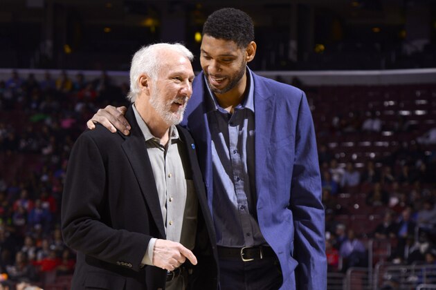 PHILADELPHIA - DECEMBER 07:  Gregg Popovich and Tim Duncan #21 of the San Antonio Spurs smile and talk during the game against the Philadelphia 76ers at the Wells Fargo Center on December 7, 2015 in Philadelphia, Pennsylvania. NOTE TO USER: User expressly acknowledges and agrees that, by downloading and or using this photograph, User is consenting to the terms and conditions of the Getty Images License Agreement. Mandatory Copyright Notice: Copyright 2015 NBAE  (Photo by David Dow/NBAE via Getty Images)