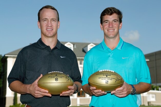 IMAGE DISTRIBUTED FOR NATIONAL FOOTBALL LEAGUE - In this photo released by the NFL, Denver Broncos quarterback Peyton Manning, left, and New York Giants quarterback Eli Manning pose for a photo during a visit to Isidore Newman School in New Orleans on Thursday, July 9, 2015. (Jonathan Bachman/AP Images for National Football League)