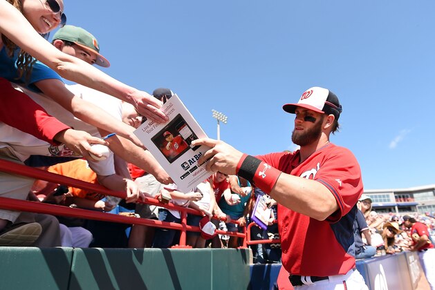 VIERA, FL - MARCH 09:  Bryce Harper #34 of the Washington Nationals signs autographs prior to a spring training game against the Atlanta Braves at Space Coast Stadium on March 9, 2015 in Viera, Florida.  (Photo by Stacy Revere/Getty Images)