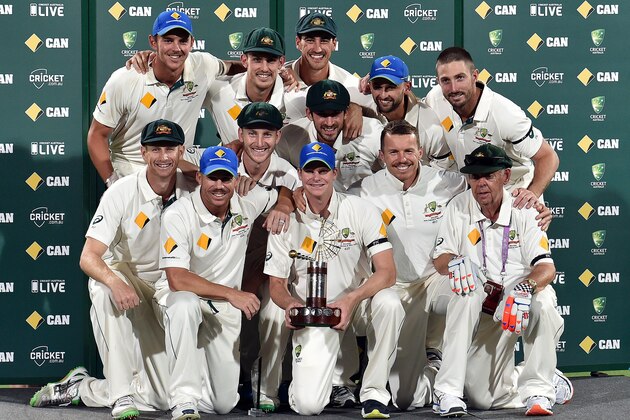 Australia's team captain Steve Smith (C) poses with teammates after defeating New Zealand in the first day-night cricket Test match at the Adelaide Oval on November 29, 2015. AFP PHOTO / SAEED KHAN
IMAGE RESTRICTED TO EDITORIAL USE - NO COMMERCIAL USE / AFP / SAEED KHAN        (Photo credit should read SAEED KHAN/AFP/Getty Images)