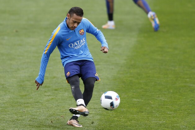 FC Barcelona's Neymar kicks the ball during a training session at Miniestadi stadium in Barcelona, Spain, Monday, Jan. 4, 2016. (AP Photo/Manu Fernandez)