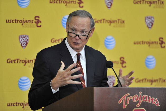 Southern California athletic director Pat Haden speaks with the media during a press conference after an NCAA college football practice in Los Angeles Tuesday, Oct. 13, 2015. He named the Trojans' offensive coordinator, Clay Helton, to take over for head coach Steve Sarkisian, whom Haden fired Monday. (AP Photo/Richard Hartog)