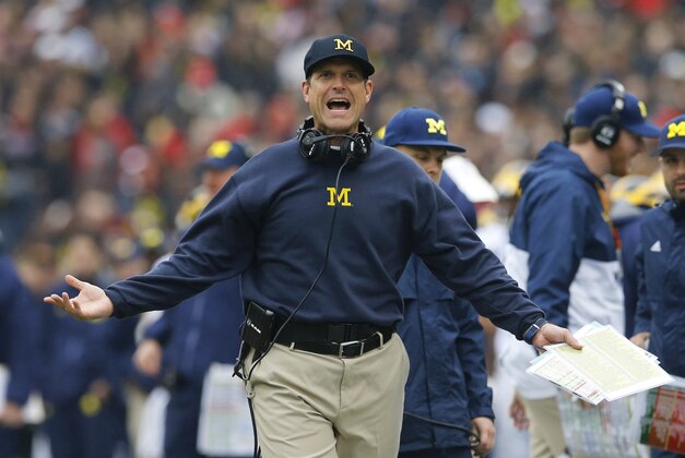 Michigan head coach Jim Harbaugh reacts after a play in the first half of an NCAA college football game against Maryland, Saturday, Oct. 3, 2015, in College Park, Md. (AP Photo/Patrick Semansky)