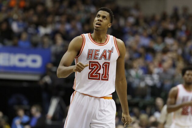 Miami Heat center Hassan Whiteside (21) reacts to his team scoring a basket during the second half of an NBA basketball game against the Dallas Mavericks Wednesday, Feb. 3, 2016, in Dallas. (AP Photo/LM Otero)