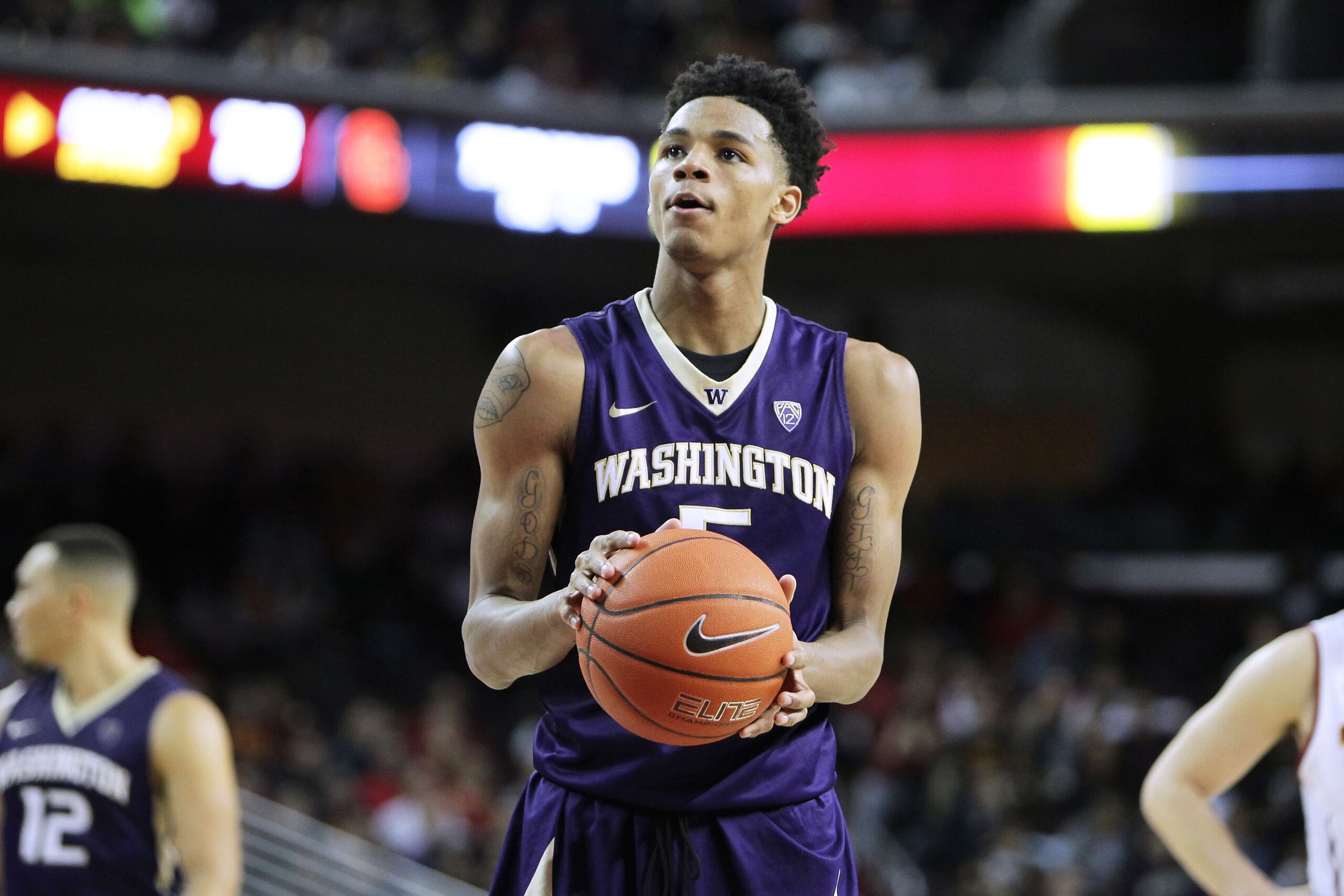 LOS ANGELES, CA - JANUARY 30: Dejounte Murray #5 of the Washington Huskies shoot free throws against the USC Trojans during a NCAA college basketball game at Galen Center on January 30, 2016 in Los Angeles, California. (Photo by Leon Bennett/Getty Images)