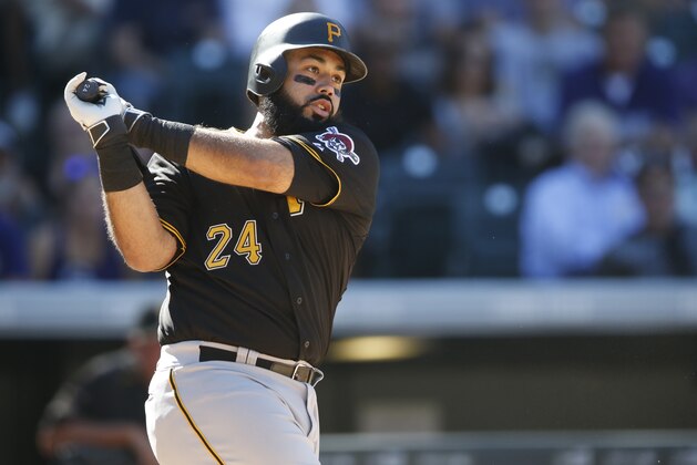 Pittsburgh Pirates first baseman Pedro Alvarez (24) bats against the Colorado Rockies in the sixth inning of a baseball game Thursday, Sept. 24, 2015, in Denver. Pittsburgh won 5-4. (AP Photo/David Zalubowski)