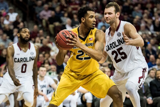 Missouri forward Jakeenan Gant, left, is defended by South Carolina forward Mindaugas Kacinas (25) during the first half of an NCAA college basketball game Saturday, Jan. 16, 2016, in Columbia, S.C. (AP Photo/Sean Rayford)
