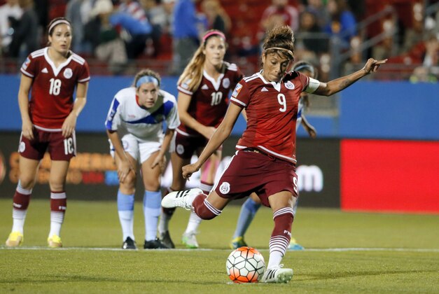 Mexico's Maribel Dominguez (9) charges the ball on a penalty kick against Puerto Rico in an CONCACAF Olympic qualifying tournament soccer match Wednesday, Feb. 10, 2016, in Frisco, Texas. Dominguez scored on the kick. Mexico won 6-0. (AP Photo/Tony Gutierrez)