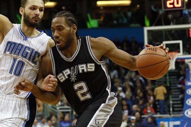 Feb 10, 2016; Orlando, FL, USA; San Antonio Spurs forward Kawhi Leonard (2) drives to the basket as Orlando Magic guard Evan Fournier (10) attempts to defend during the second half at Amway Center. San Antonio defeated Orlando 98-96. Mandatory Credit: Kim Klement-USA TODAY Sports