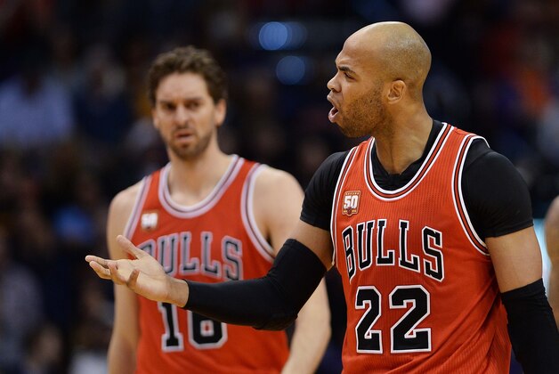 Nov 18, 2015; Phoenix, AZ, USA; Chicago Bulls forward Taj Gibson (22) reacts on the court in front of teammate center Pau Gasol (16) against the Phoenix Suns at Talking Stick Resort Arena. The Bulls won 103-97. Mandatory Credit: Jennifer Stewart-USA TODAY Sports