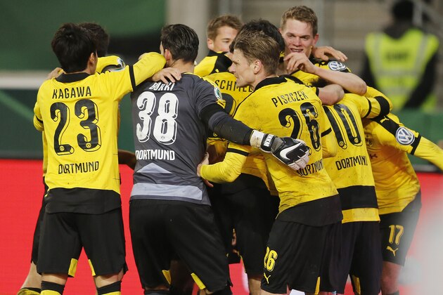 Dortmund's players celebrate their side's third goal during a quarterfinal match of the German soccer cup between VfB Stuttgart and Borussia Dortmund in Stuttgart, Germany, Tuesday, Feb. 9, 2016. (AP Photo/Michael Probst)