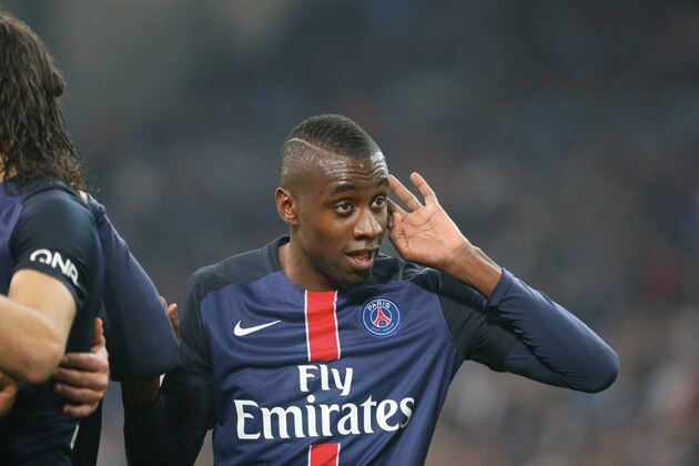 MARSEILLE, FRANCE - FEBRUARY 07:  Blaise Matuidi of Paris Saint-Germain reacts with fan of Olympique de Marseille after the goal of Angel Di Maria during the French  Ligue 1 between Olympique de Marseille and Paris Saint-Germain at Stade Velodrome on february 7, 2016 in Marseille, France.  (Photo by Xavier Laine/Getty Images)