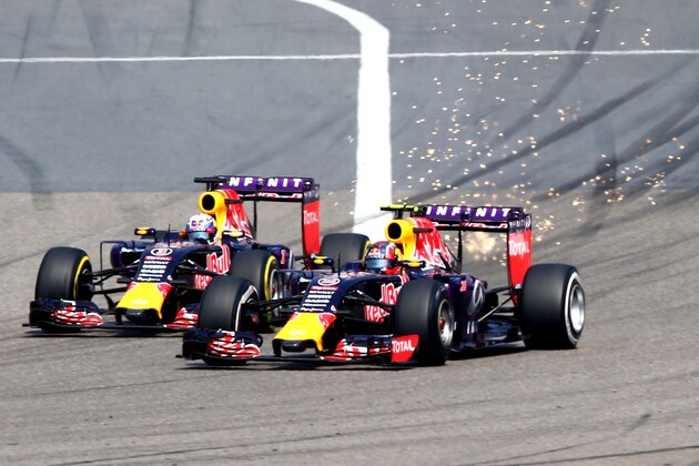 SHANGHAI, CHINA - APRIL 12:  Teammates Daniel Ricciardo of Australia and Infiniti Red Bull Racing and Daniil Kvyat of Russia and Infiniti Red Bull Racing compete going into turn one during the Formula One Grand Prix of China at Shanghai International Circuit on April 12, 2015 in Shanghai, China.  (Photo by Mark Thompson/Getty Images)