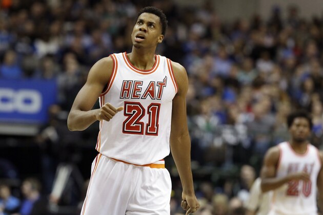 FILE - In this Feb. 3, 2016, file photo, Miami Heat center Hassan Whiteside (21) reacts to his team scoring a basket during the second half of an NBA basketball game against the Dallas Mavericks in Dallas. Whiteside leads the NBA in blocked shots, ranks fifth in the league in rebounds per game and has all three of Miami's triple-doubles this season. That's a star's resume. But even all that isn't enough to guarantee his future with the Heat, who still can't be sure if they can count on the enigmatic center. (AP Photo/LM Otero, File)