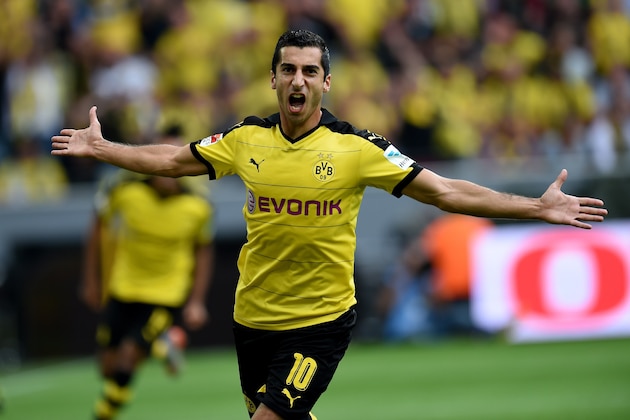 Dortmund's Armenian midfielder Henrikh Mkhitaryan reacts during the German first division Bundesliga football match Borussia Dortmund vs Borussia Moenchengladbach in Dortmund, western Germany, on August 15, 2015.  AFP PHOTO / PATRIK STOLLARZ  RESTRICTIONS: DURING MATCH TIME: DFL RULES TO LIMIT THE ONLINE USAGE TO 15 PICTURES PER MATCH AND FORBID IMAGE SEQUENCES TO SIMULATE VIDEO.  == RESTRICTED TO EDITORIAL USE == FOR FURTHER QUERIES PLEASE CONTACT DFL DIRECTLY AT + 49 69 650050.        (Photo credit should read PATRIK STOLLARZ/AFP/Getty Images)
