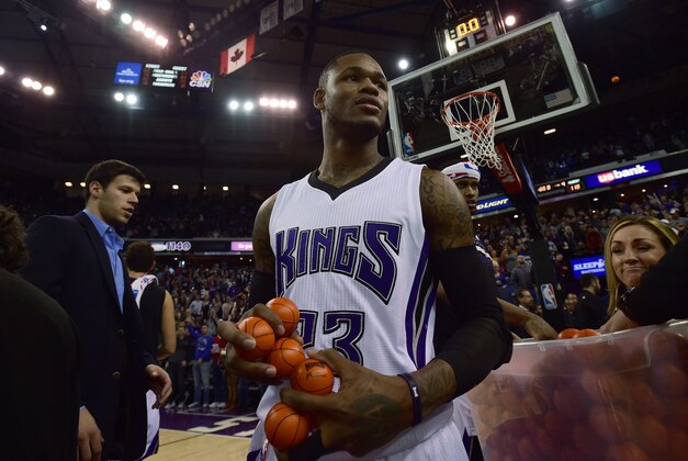 Jan 2, 2016; Sacramento, CA, USA; Sacramento Kings guard Ben McLemore (23) grabs promotional mini basketball to throw to fans after defeating the Phoenix Suns 142-119 at Sleep Train Arena. Mandatory Credit: Godofredo Vasquez-USA TODAY Sports