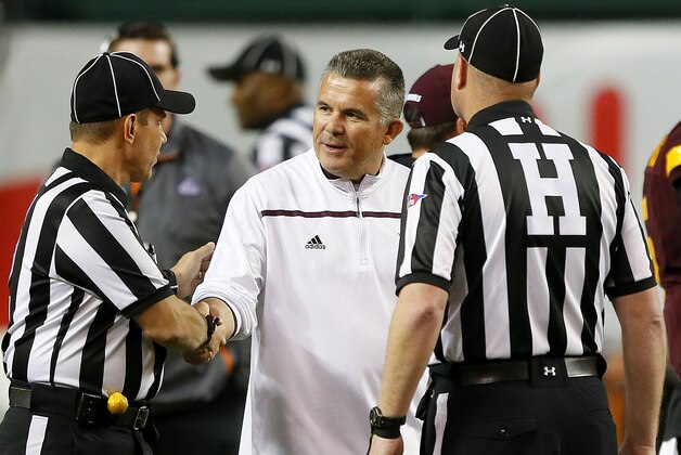 Arizona State coach Todd Graham greets the officials prior to his team's Cactus Bowl NCAA College football game against West Virginia, Saturday, Jan. 2, 2016, in Phoenix. (AP Photo/Matt York)