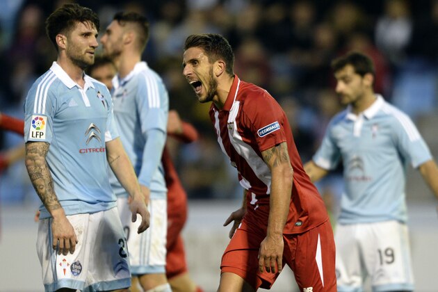 Sevilla's Portuguese midfielder Daniel Carrico (C) celebrates a goal during the Spanish league football match RC Celta de Vigo vs Sevilla FC at the Balaidos stadium in Vigo on February 7, 2016. AFP PHOTO / MIGUEL RIOPA / AFP / MIGUEL RIOPA        (Photo credit should read MIGUEL RIOPA/AFP/Getty Images)
