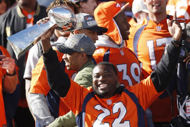 Denver Broncos running back C.J. Anderson holds the Lombardi Trophy at a rally following a parade through downtown Tuesday, Feb. 9, 2016 in Denver. Fans crowded into Denver's downtown to salute the Broncos for the team's victory over the Carolina Panthers in Super Bowl 50. (AP Photo/David Zalubowski)