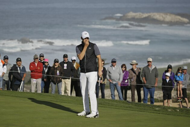 Jordan Spieth reacts after missing a birdie putt on the second green of the Spyglass Hill Golf Course during the first round of the AT&T Pebble Beach National Pro-Am golf tournament Thursday, Feb. 11, 2016, in Pebble Beach, Calif. (AP Photo/Eric Risberg)