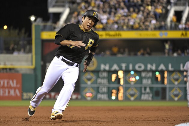 Pittsburgh Pirates' Jung Ho Kang bats against the Milwaukee Brewers during a game, Friday, Sept. 11, 2015, in Pittsburgh.  (AP Photo/Fred Vuich)