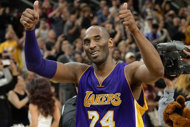 FILE - In this  Saturday, Feb. 6, 2016 file photo, Los Angeles Lakers guard Kobe Bryant gestures to fans as he walks off of the court after an NBA basketball game against the San Antonio Spurs in San Antonio. The final NBA All-Star Game for Bryant and the first to be staged outside the U.S. is in Toronto, the city that staged the first NBA game 70 years ago and is so enthusiastic for basketball now that it could no longer be ignored no matter what the thermometer says. (AP Photo/Darren Abate, File)