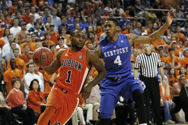 Auburn guard Kareem Canty (1) drives the ball to the basket against Kentucky guard Charles Matthews (4) during the second half of an NCAA college basketball game, Saturday, Jan. 16, 2016, in Auburn, Ala. Auburn won 75-70. (AP Photo/Brynn Anderson)