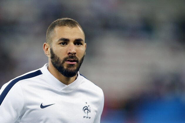 France's forward Karim Benzema looks on during a warm up prior to the friendly football match between France and Armenia on October 8, 2015 at the Allianz Riviera stadium in Nice, southeastern France. AFP PHOTO / VALERY HACHE        (Photo credit should read VALERY HACHE/AFP/Getty Images)