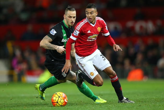 MANCHESTER, ENGLAND - FEBRUARY 02: Jesse Lingard of Manchester United and Marko Arnautovic of Stoke City compete for the ball during the Barclays Premier League match between Manchester United and Stoke City at Old Trafford on February 2, 2016 in Manchester, England.  (Photo by Alex Livesey/Getty Images)