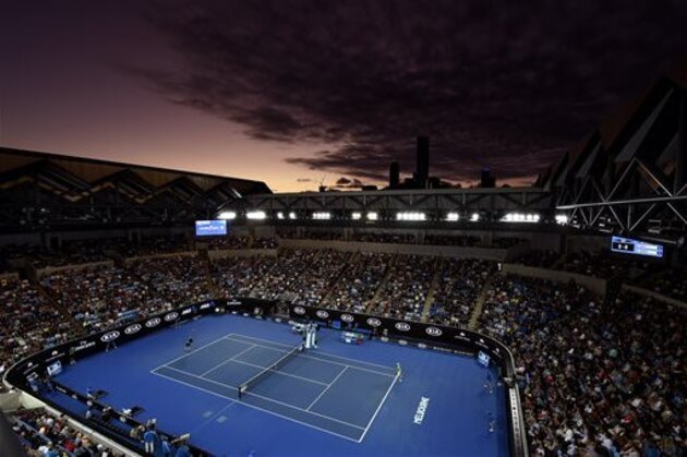 FILE - In this Saturday, Jan. 23, 2016, file photo, Andy Murray of Britain serves to Joao Sousa of Portugal on Margaret Court Arena at sunset during their third round match at the Australian Open tennis championships in Melbourne, Australia. (AP Photo/Andrew Brownbill)