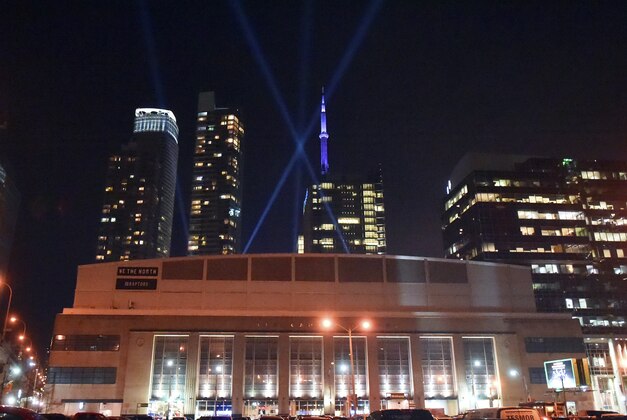 Dec 22, 2015; Toronto, Ontario, CAN;  Spotlights criss-cross the sky above Air Canada Centre prior to Toronto Raptors hosting the Dallas Mavericks. Mandatory Credit: Dan Hamilton-USA TODAY Sports