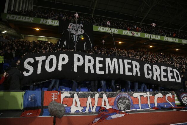 Crystal Palace fans hold up a protest banner during the English FA Cup fifth round soccer match between Crystal Palace and Liverpool at Selhurst Park stadium in London, Saturday, Feb. 14, 2015.  (AP Photo/Matt Dunham)