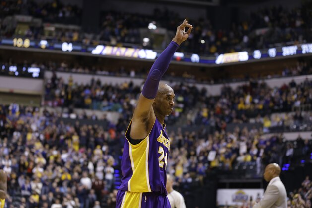 Los Angeles Lakers forward Kobe Bryant (24) waves to fans as he leaves the game in the final seconds of the second half of an NBA basketball game against the Indiana Pacers in Indianapolis, Monday, Feb. 8, 2016. The Pacers defeated the Lakers 89-87. (AP Photo/Michael Conroy)
