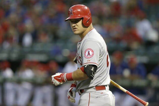 Los Angeles Angels  Mike Trout looks to the dugout for a call during the first inning of a baseball game against the Texas Rangers in Arlington, Texas, Friday, Oct. 2, 2015. (AP Photo/LM Otero)