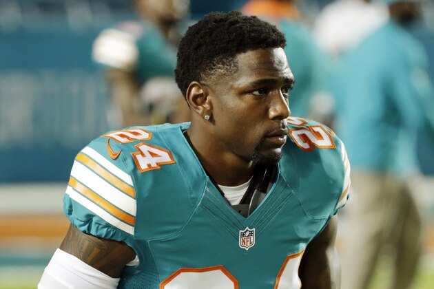 Miami Dolphins cornerback Brice McCain (24) walks off the field before an NFL football game against the New York Giants, Monday, Dec. 14, 2015, in Miami Gardens, Fla.  (AP Photo/Wilfredo Lee)