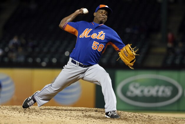 New York Mets relief pitcher Jenrry Mejia delivers to the Texas Rangers in the eighth inning of a exhibition baseball game Friday, April 3, 2015, in Arlington, Texas. The Mets won 5-0. (AP Photo/Tony Gutierrez)