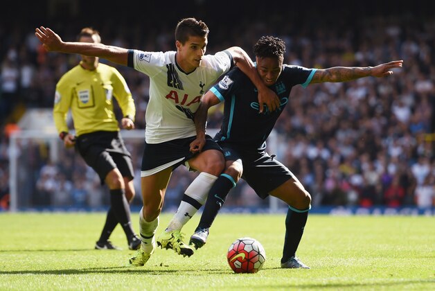 LONDON, ENGLAND - SEPTEMBER 26: Raheem Sterling of Manchester City and Erik Lamela of Tottenham Hotspur compete for the ball during the Barclays Premier League match between Tottenham Hotspur and Manchester City at White Hart Lane on September 26, 2015 in London, United Kingdom.  (Photo by Tom Dulat/Getty Images)