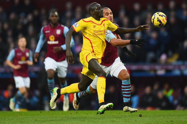 BIRMINGHAM, ENGLAND - JANUARY 17:  Mamadou Sakho of Liverpool and Gabriel Agbonlahor of Aston Villa battle for the ball during the Barclays Premier League match between Aston Villa and Liverpool at Villa Park on January 17, 2015 in Birmingham, England.  (Photo by Laurence Griffiths/Getty Images)