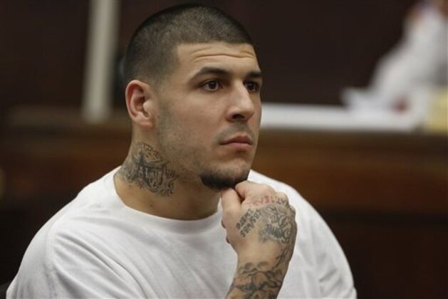 Former New England Patriots NFL football player Aaron Hernandez attends a pre-trial hearing at Suffolk Superior Court, Tuesday, Dec. 22, 2015, in Boston. Hernandez is charged with killing two Boston men in 2012 after a chance encounter at a nightclub. (AP Photo/Steven Senne, Pool)