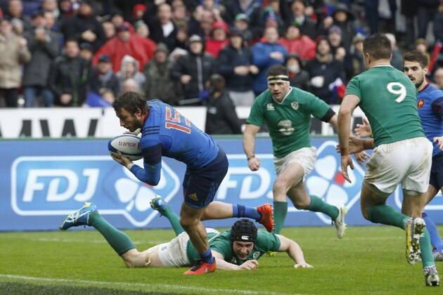 France's fullback Maxime Medard (2nd L) evades Ireland's back row Tommy O'Donnell  (Bottom) on his way to score the winning try during the Six Nations international rugby union match between France and Ireland at the Stade de France Stadium in Saint-Denis, north of Paris, on February 13, 2016.  AFP PHOTO / THOMAS SAMSON / AFP / THOMAS SAMSON        (Photo credit should read THOMAS SAMSON/AFP/Getty Images)