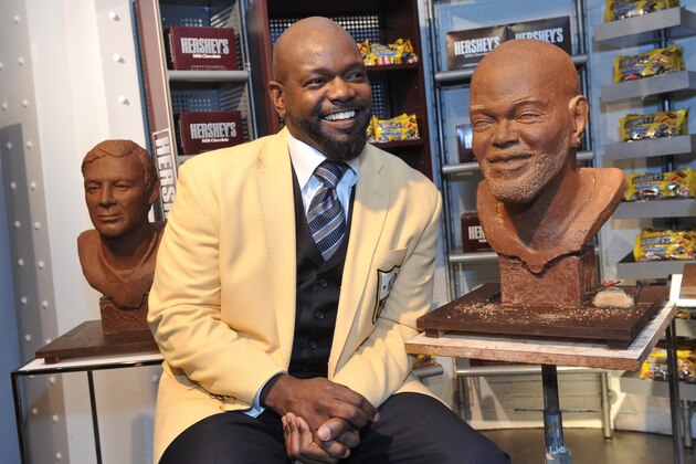 Pro Football Hall of Famer Emmitt Smith strikes a pose next to his chocolate bust at the Hershey's Times Square store in New York, Friday, Jan. 14, 2011.  The NFL's leading all-time rusher was at the store to kick off the Hershey's Pro Football Hall of Fame sweepstakes offering fans a trip to the Hall of Fame Enshrinement Celebration.  For more information visit  www.Hersheys.com/halloffame.  (Diane Bondareff/AP Images for Hershey's)