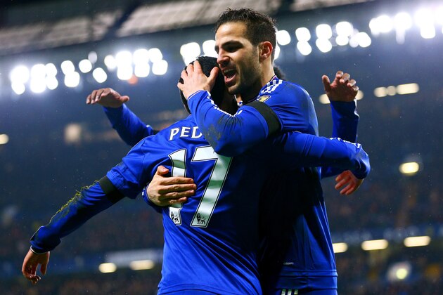 LONDON, ENGLAND - FEBRUARY 13:  Pedro (L) of Chelsea celebrates scoring his team's second goal with his team mate Sesc Fabregas (R) during the Barclays Premier League match between Chelsea and Newcastle United at Stamford Bridge on February 13, 2016 in London, England.  (Photo by Clive Mason/Getty Images)