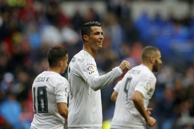 Real Madrid's Cristiano Ronaldo, center, celebrates after scoring a goal during a Spanish La Liga soccer match between Real Madrid and Athtletic Bilbao at the Santiago Bernabeu stadium in Madrid, Spain, Saturday, Feb. 13, 2016. (AP Photo/Daniel Ochoa de Olza)