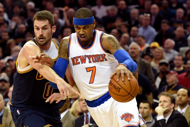 CLEVELAND, OH - OCTOBER 30: Carmelo Anthony #7 of the New York Knicks handles the ball against Kevin Love #0 of the Cleveland Cavaliers in the first quarter at Quicken Loans Arena on October 30, 2014 in Cleveland, Ohio. NOTE TO USER: User expressly acknowledges and agrees that, by downloading and or using this photograph, User is consenting to the terms and conditions of the Getty Images License Agreement.  (Photo by Jason Miller/Getty Images)